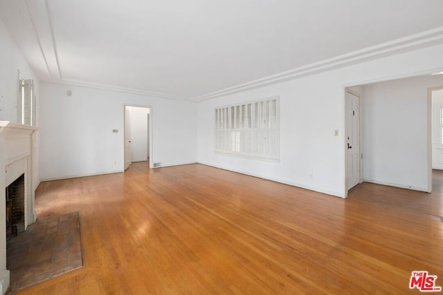 unfurnished living room featuring light hardwood / wood-style floors