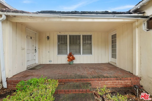 entrance to property with a patio