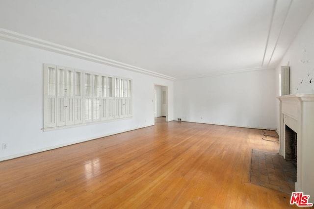 unfurnished living room featuring light hardwood / wood-style floors