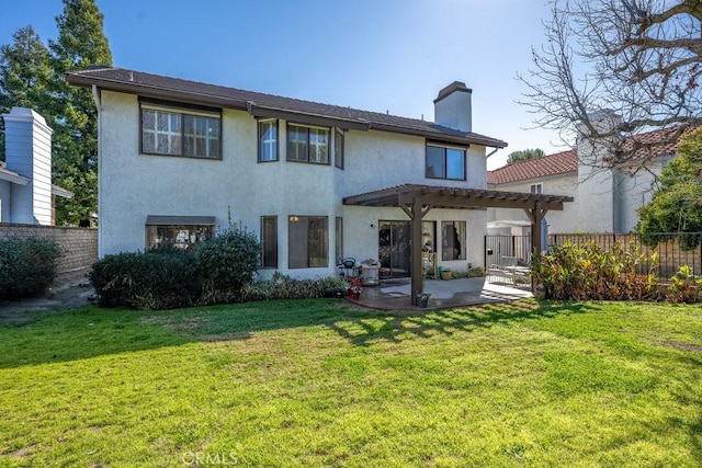 back of property featuring a lawn, a chimney, fence, and a pergola