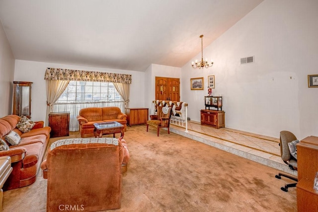 living room with carpet floors, visible vents, high vaulted ceiling, and an inviting chandelier