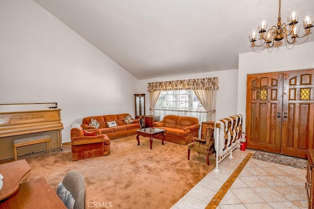 living area with high vaulted ceiling, light tile patterned floors, and an inviting chandelier