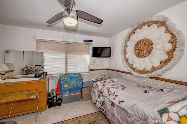 bedroom featuring a ceiling fan and light tile patterned floors