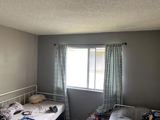 bedroom featuring a textured ceiling