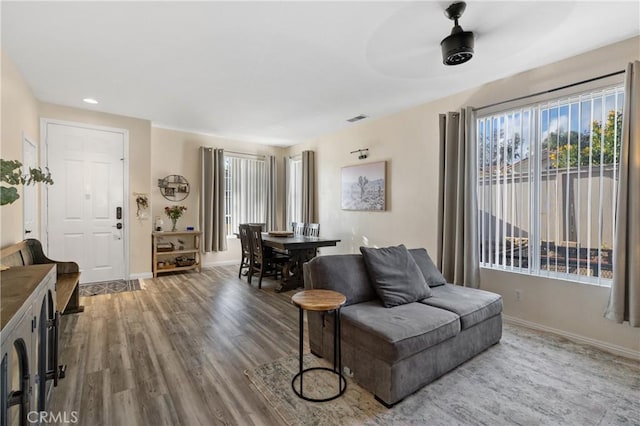 interior space with hardwood / wood-style floors and ceiling fan