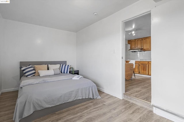 bedroom with light wood-type flooring