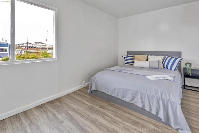 bedroom with light hardwood / wood-style flooring