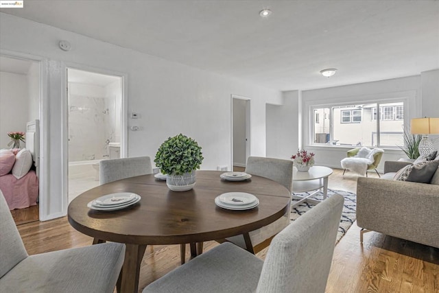 dining area with light hardwood / wood-style flooring