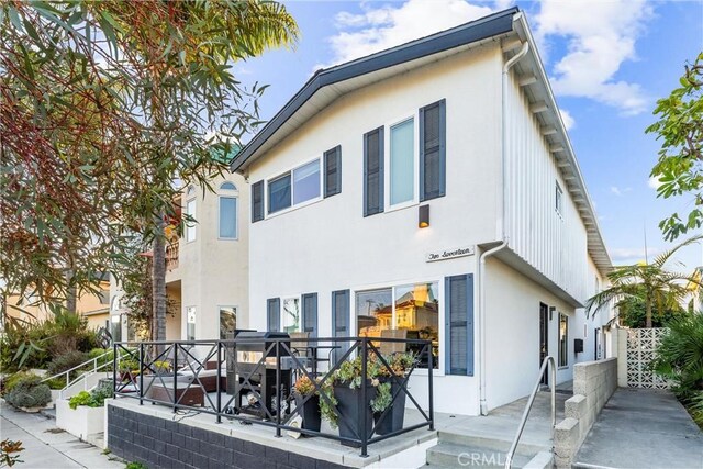 217 10th St, Seal Beach, CA 90740 - back of property featuring stucco siding