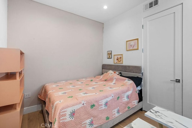 bedroom featuring light wood-type flooring