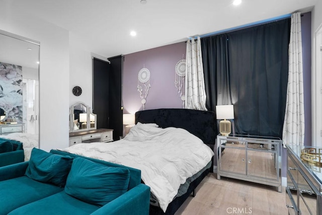 bedroom featuring light wood-type flooring