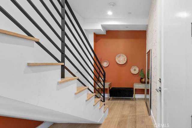 stairway featuring hardwood / wood-style flooring