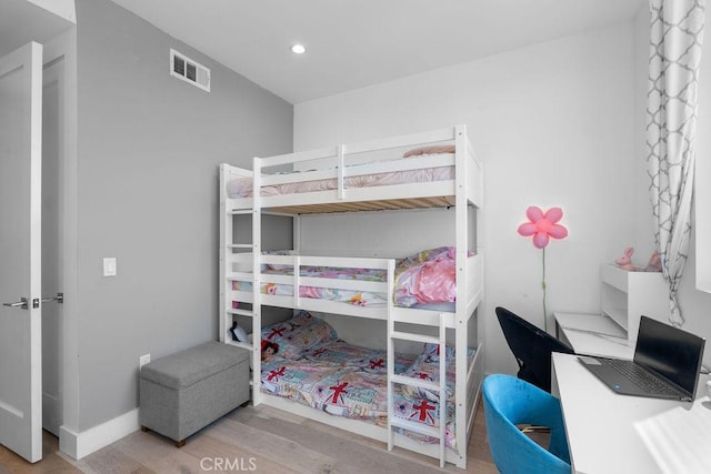 bedroom with light wood-type flooring