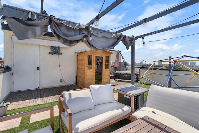 view of patio / terrace with an outdoor living space and a deck