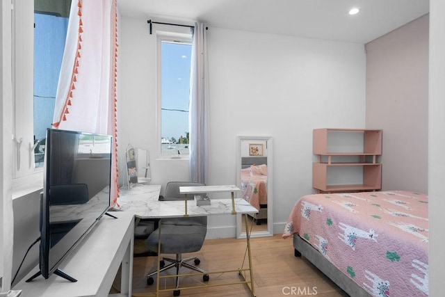 bedroom featuring light hardwood / wood-style floors