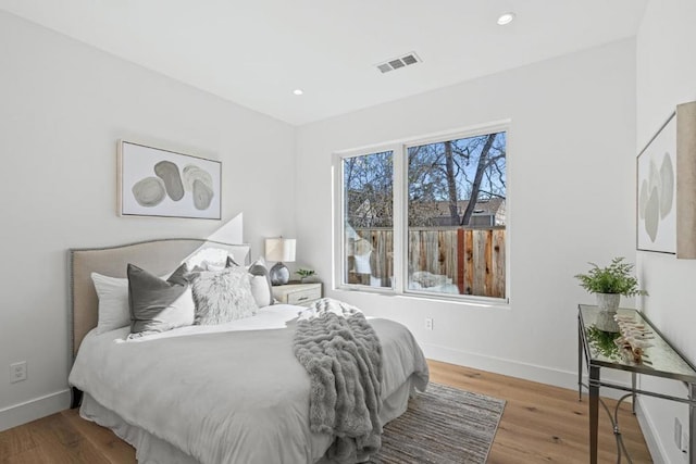 bedroom with light hardwood / wood-style floors