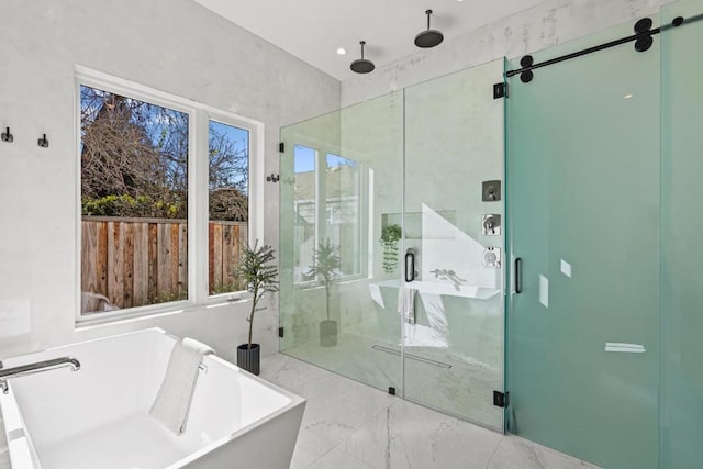 bathroom with separate shower and tub