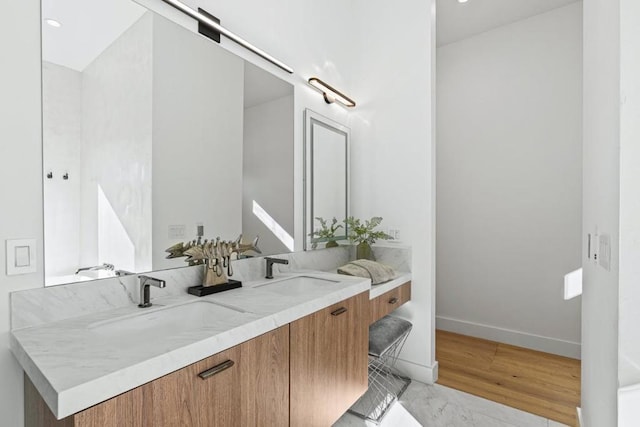 bathroom featuring vanity and hardwood / wood-style floors