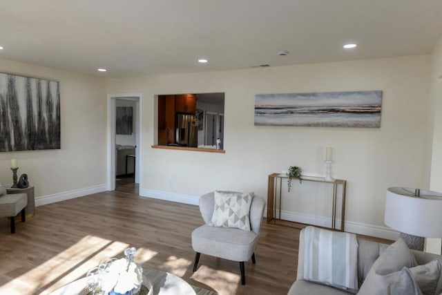 living room with light hardwood / wood-style flooring