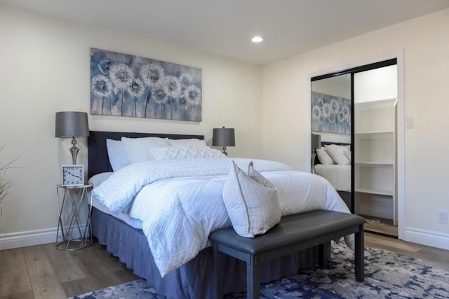 bedroom featuring a closet and dark hardwood / wood-style floors