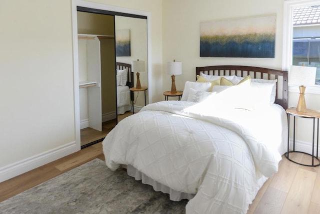 bedroom with hardwood / wood-style flooring and a closet