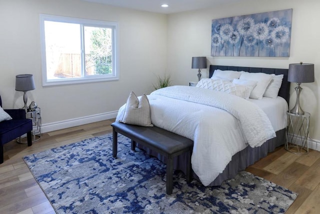 bedroom with hardwood / wood-style flooring