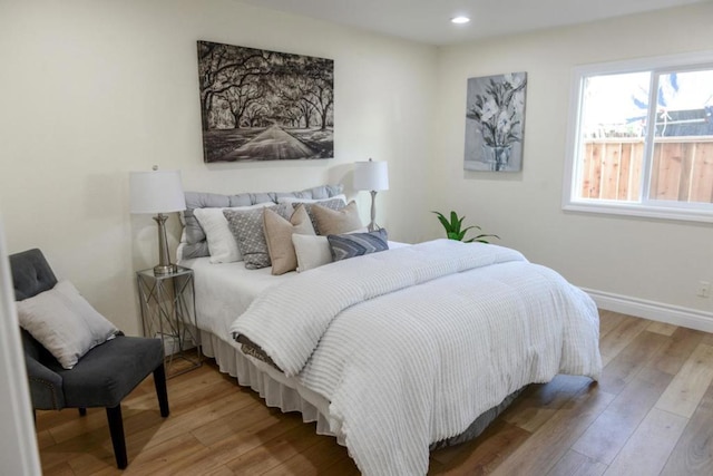 bedroom with light hardwood / wood-style flooring