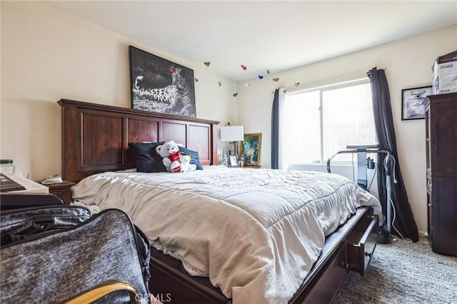 bedroom featuring dark carpet