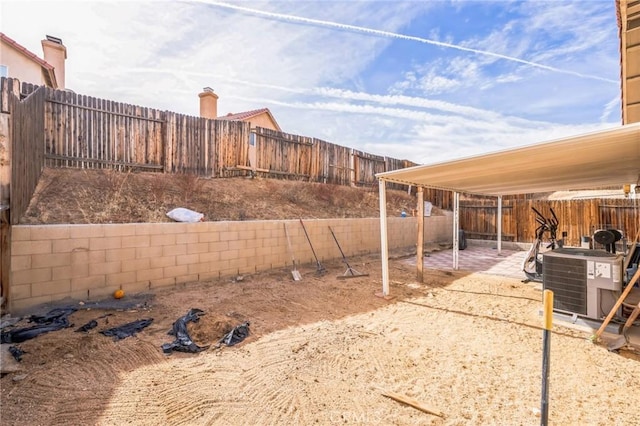 view of yard featuring central AC and a patio area