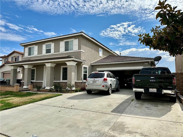 view of front of home with a porch and a garage