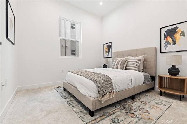 bedroom featuring light colored carpet