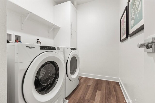 washroom featuring dark hardwood / wood-style floors and independent washer and dryer