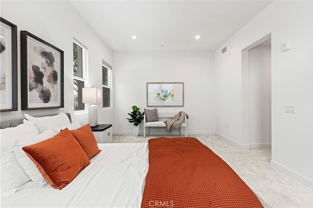 bedroom with light colored carpet