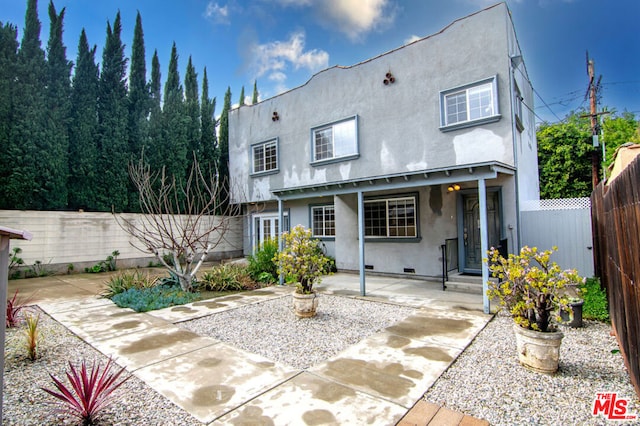 rear view of house with a patio