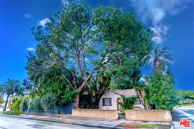 view of property hidden behind natural elements