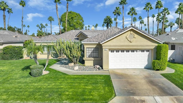 ranch-style house featuring a garage and a front yard