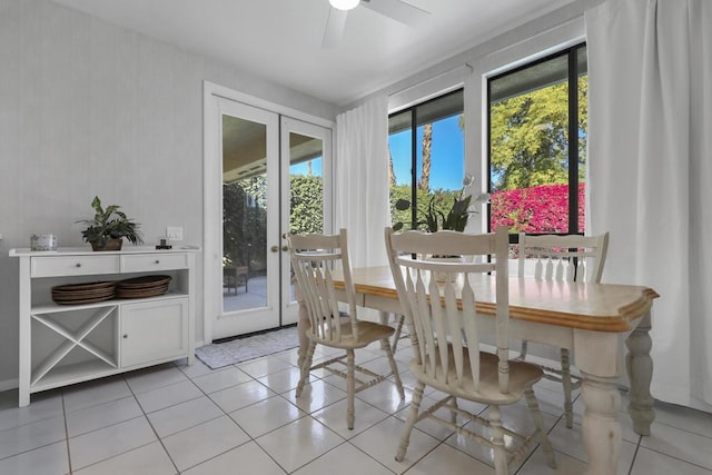 tiled dining room featuring french doors, ceiling fan, and a wealth of natural light