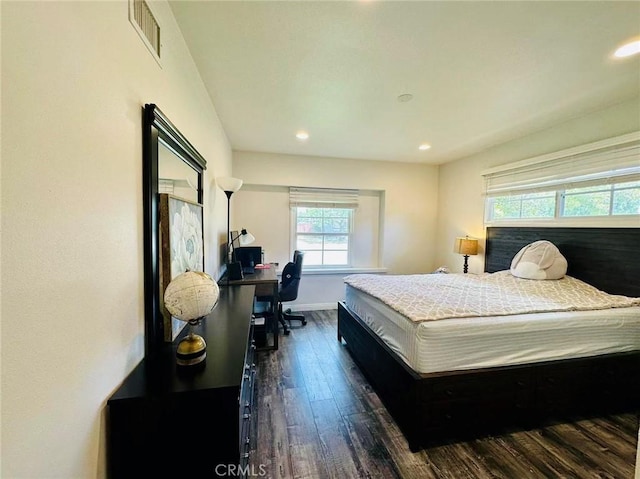 bedroom with dark wood-type flooring