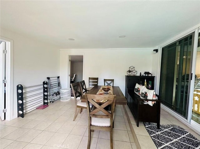 dining area featuring light tile patterned floors