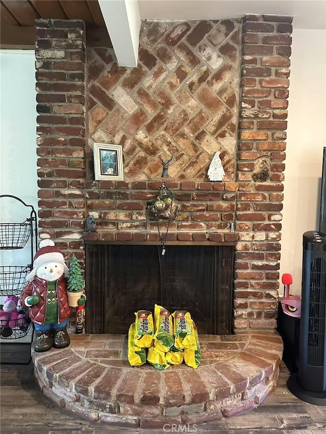 interior details featuring a brick fireplace