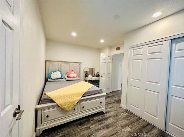 bedroom featuring dark hardwood / wood-style flooring