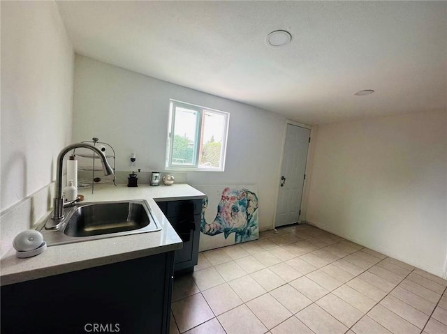 kitchen with sink and light tile patterned floors