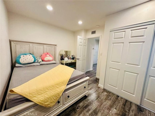 bedroom with dark hardwood / wood-style flooring