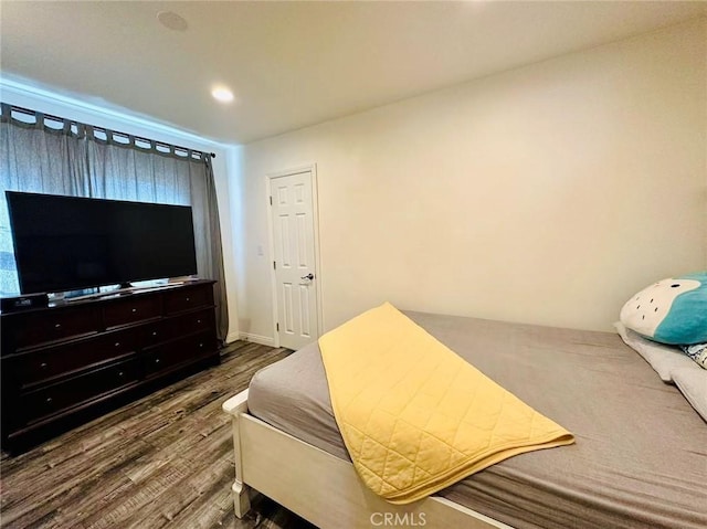 bedroom with hardwood / wood-style floors