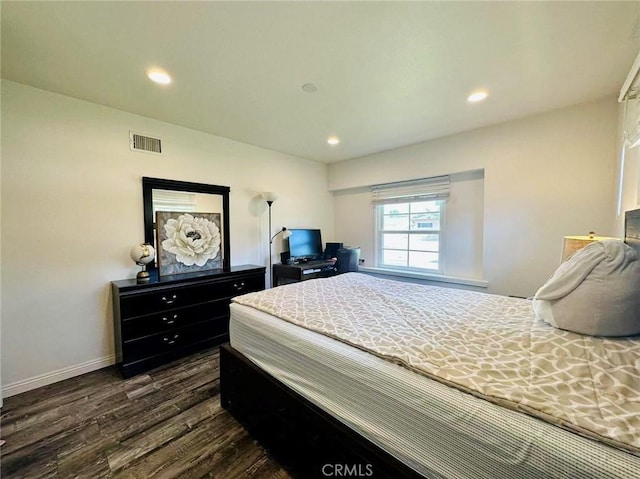 bedroom featuring dark hardwood / wood-style floors