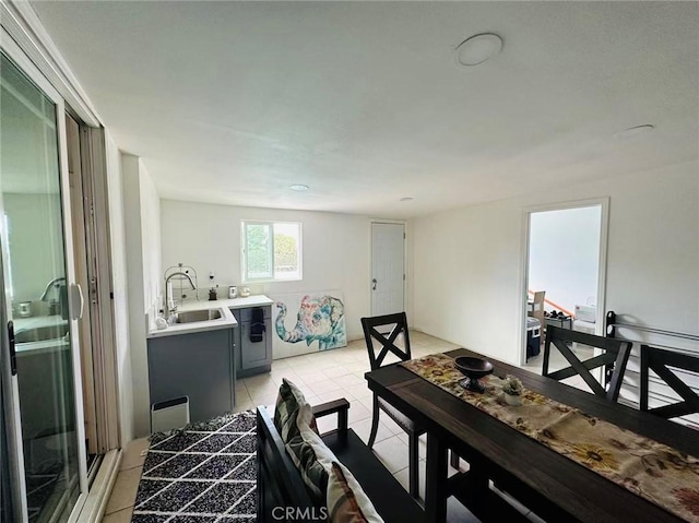 tiled dining space featuring sink