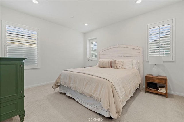 bedroom featuring recessed lighting, baseboards, and light colored carpet