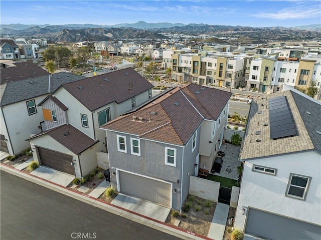 bird's eye view with a residential view and a mountain view