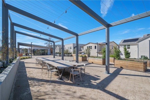 view of patio / terrace featuring a residential view and a pergola