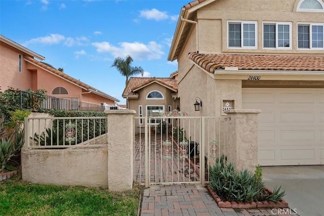 view of gate featuring a garage